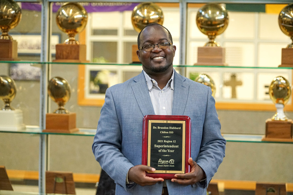 Superintendent Dr. Brandon Hubbard was presented with the Region 12 Superintendent of The Year Award by Region 12 Executive Director Dr. Jerry Maze